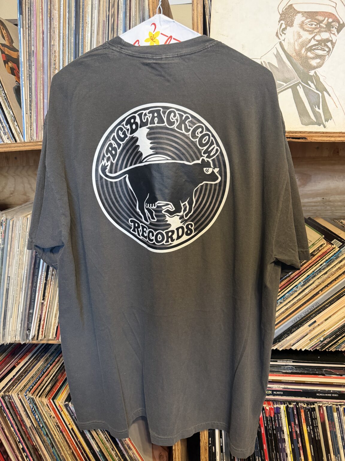 Large cow and record logo printed on the back of a gray BBCR shirt