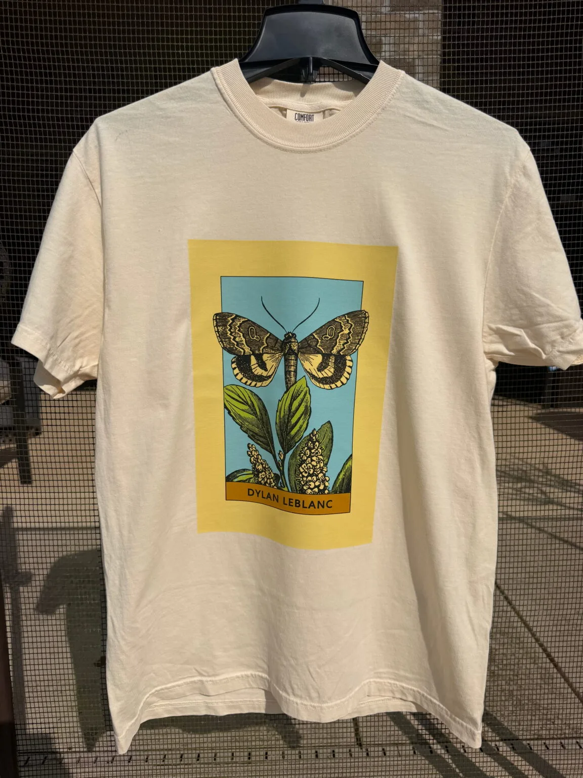 Dylan LeBlanc moth artwork printed on an ivory shirt